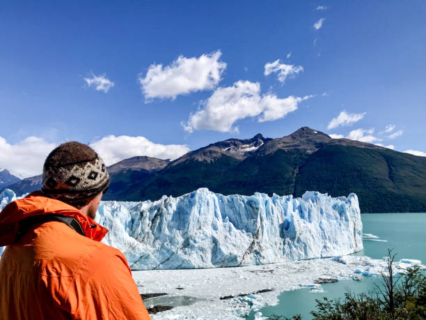 istock Man looking at glacier in Patagonia 1445891289
