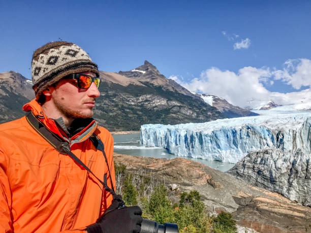 istock Man looking at glacier in Patagonia 1445891338