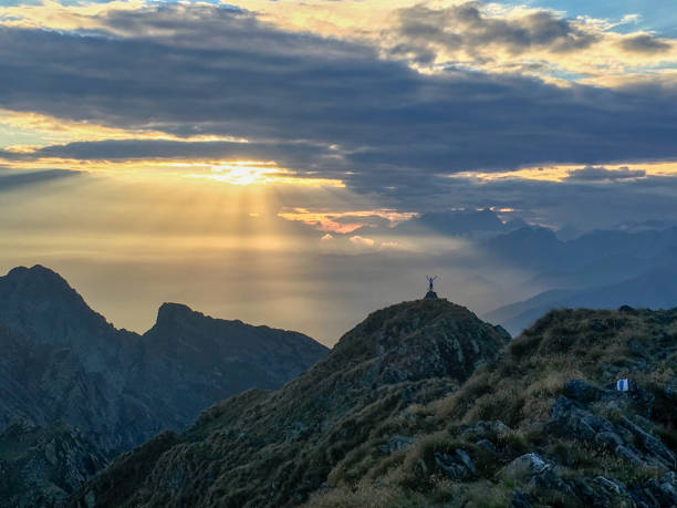 Distant view of man on top of mountain