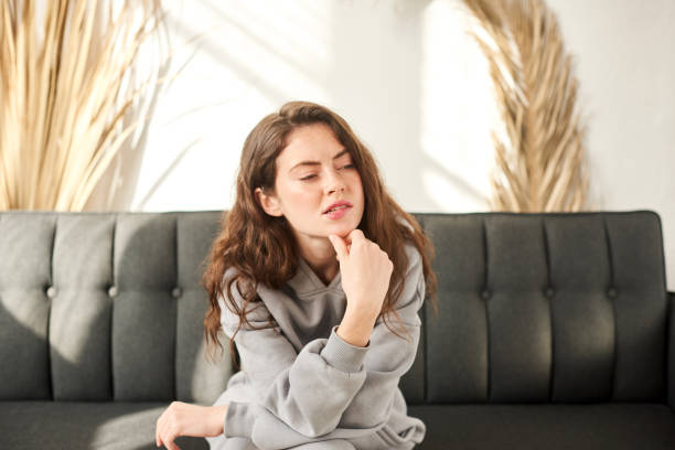 istock woman making difficult decision, reasoning, weighing pros and cons 1445895089