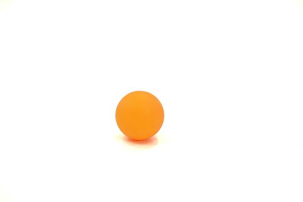 istock The image shows an orange table tennis ball on a white background, isolated. 1445897390