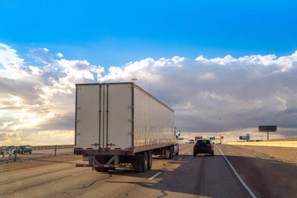 White semi-truck driving on the highway