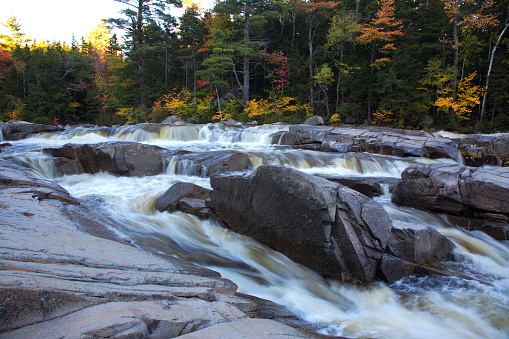 Swift River cascades in New Hampshire's Rocky Gorge scenic area – popular tourist destination in the White Mountains in summer and fall