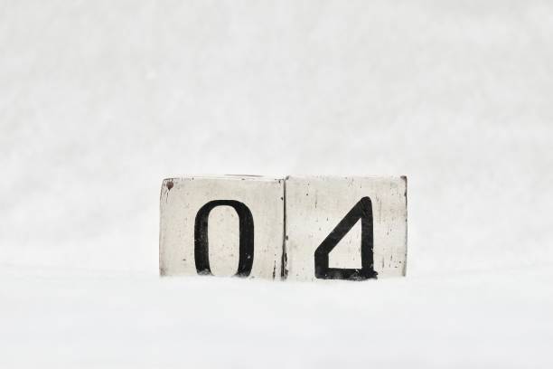 istock 04 calendar date number, white snowy winter background copy space 1445907375