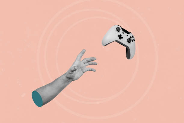 istock Hand catching flying game joystick on creative abstract pink background 1445907644