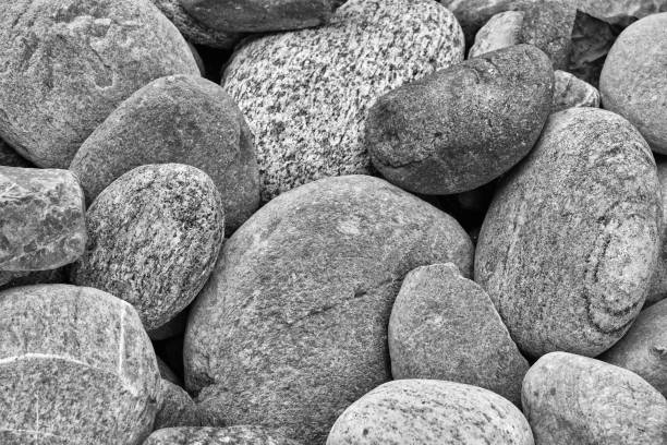 Small sea stones texture for background, monochrome image.