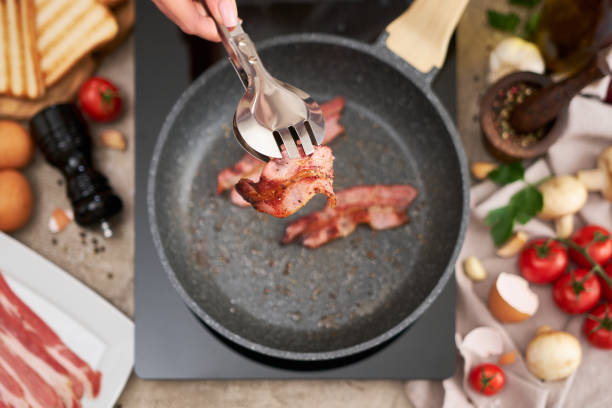 Sliced bacon on pan.