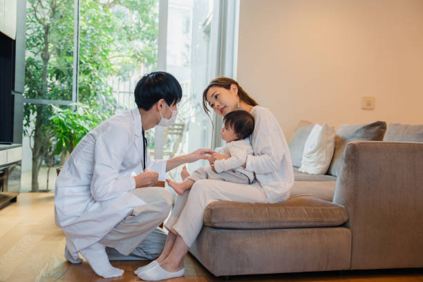 istock A baby being treated by a visiting doctor 1445911770