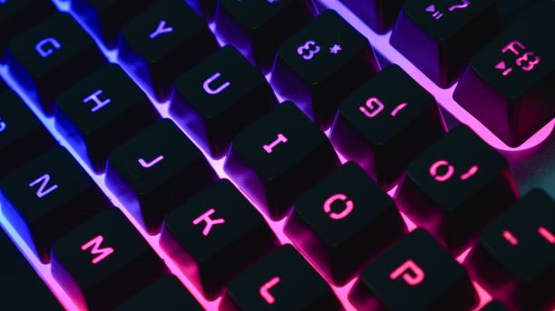istock Gaming keyboard with RGB light. White mechanical keyboard. Gamer's workspace, neon light 1445915407