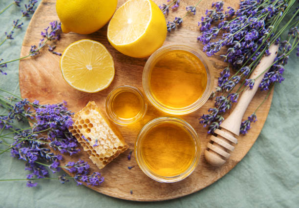 istock Jar with honey and fresh lavender flowers 1445916291
