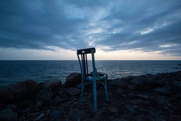 istock Lonely chair looking towards the infinity. 1445916807