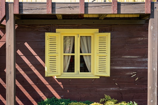 An old fashioned yellow window frame