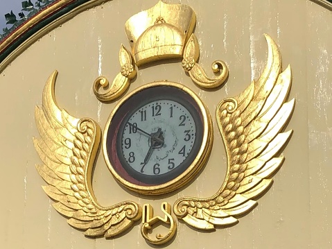 The clock on the front arch of the mosque
