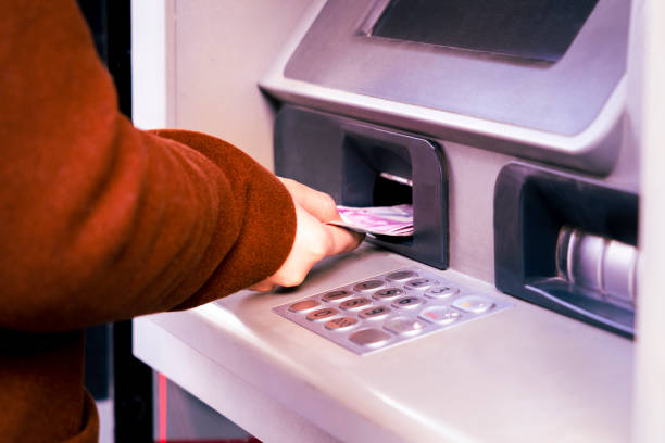 istock Someone who deposits money at the ATM 1445919320