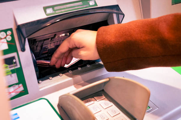 istock Someone who deposits money at the ATM 1445919418