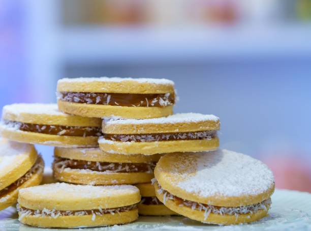 istock Cornstarch cookies with manjar and powdered sugar served on the white plate 1445920177