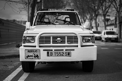 Barcelona, Spain – November 14, 2020: tow truck white color in the city. Nissan Patrol classic