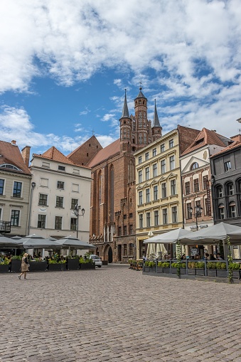Torun, Poland – May 26, 2022: A vertical shot of the main square of historical Old Town in Torun, a UNESCO World Heritage Site, Poland
