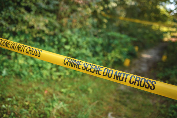 istock Crime Scene Tape Blocking a Public Area From Passers-By 1445922045
