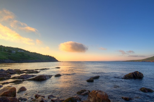 A beautiful shot of a sunrise sky over the rocky shore of Flatrock, Newfoundland and Labrador, Canada