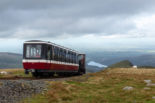 Wales, United Kingdom – October 21, 2021: The Snowdonia mountain railway nearing the summit in Wales