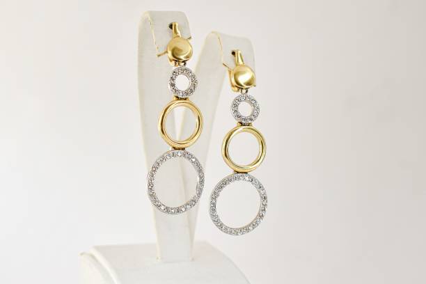 istock Geometric circles golden earrings with shiny on disolay 1445925305