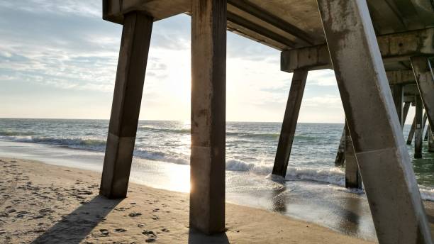 istock View of sea waves breaking sandy beach 1445925497