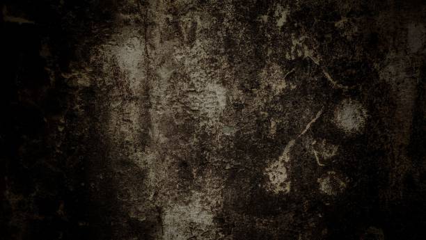istock Closeup of dark black grunge wall texture 1445927083