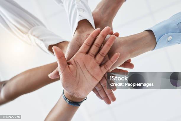 Hands Collaboration And Motivation With A Team In Business Standing In A Huddle Or Circle From Below Teamwork Success And Unity With An Employee Group Working Together With A Goal Or Vision Stock Photo - Download Image Now