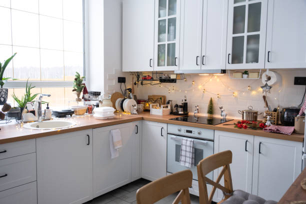 istock Festive Christmas decor and mess in the light kitchen, festive breakfast, white scandi interior. New Year, mood, cozy home 1445928921
