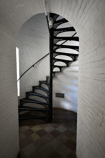 The Cast iron staircase inside the Erie Land Lighthouse, vertical shot