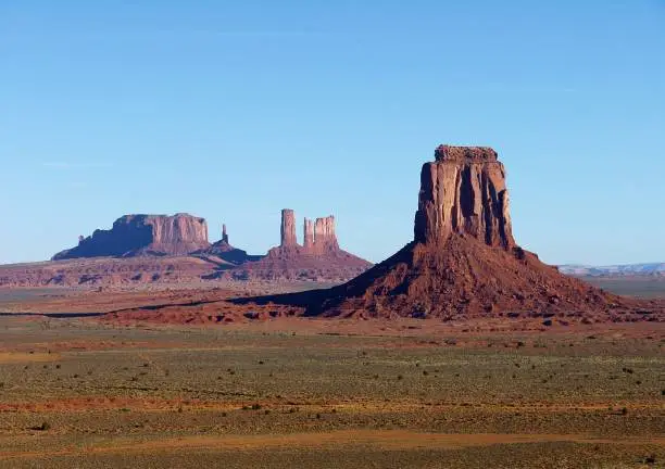 The popular red-sand Monument Valley on the Arizona-Utah border at sunset