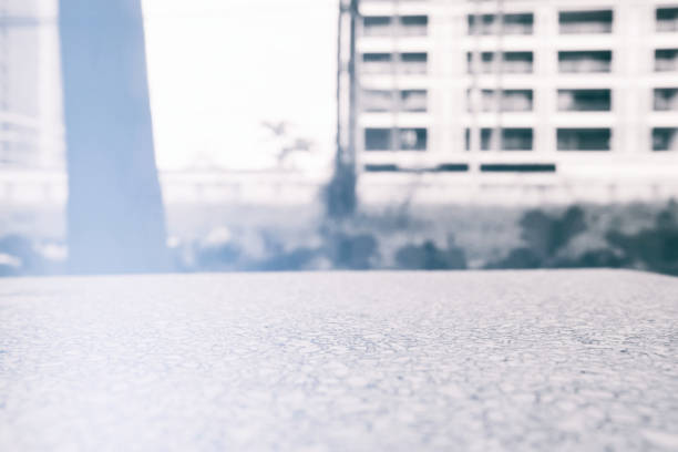 istock Marble Table with Blurred Scenery of Building Background. 1445931153