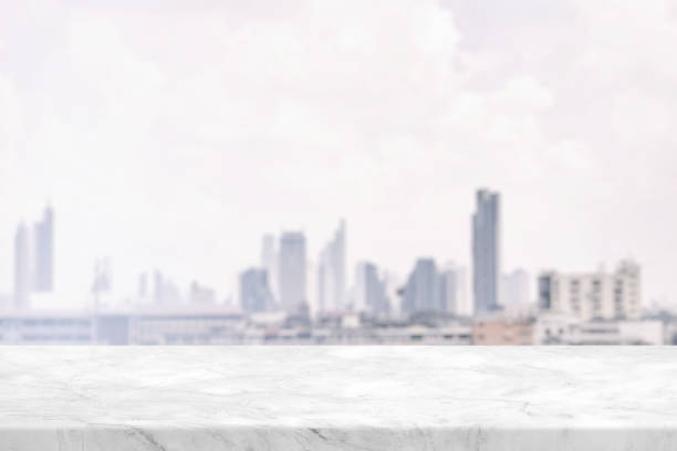 istock Marble Table with White Blurred Cityscape Background Background, Suitable for Product Presentation Backdrop, Display, and Mock up. 1445932644