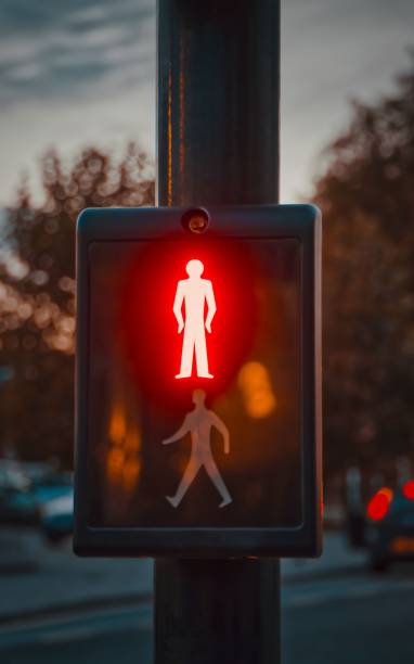 istock Red man light at traffic lights on an evening in Autumn 1445933176