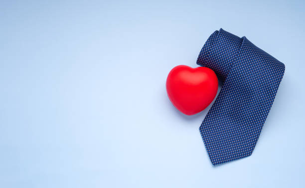 istock Happy Father's Day with a blue tie and red heart on a light blue background 1445935358