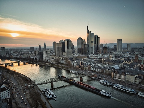 A long exposure of Frankfurt's cityscape with river Main at sunset, Germany