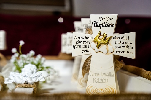 A closeup shot of small cross Baptism gifts for guests