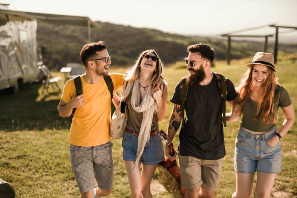 istock Young happy couples leaving the trailer park in springtime. 1445939310