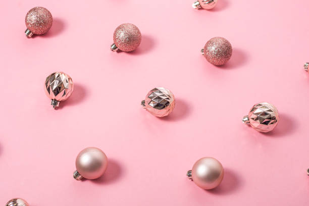 istock Background with beautiful shiny pink decorative balls on a pink background. Top view, flat lay. 1445948808