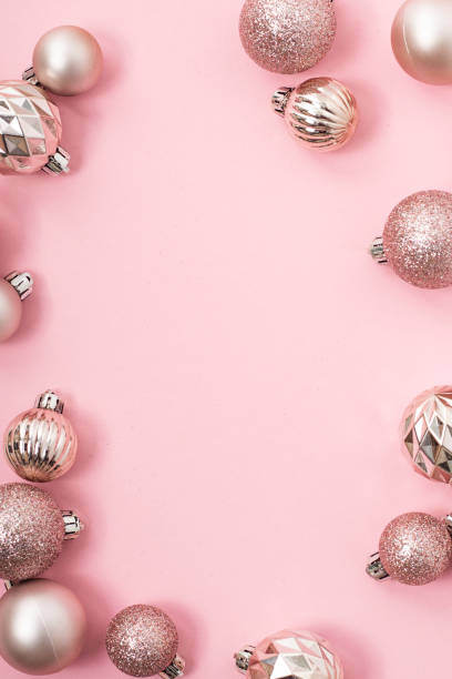 istock Decorative pink shiny balls, place for text on a pink background. Top view, flat lay. 1445949018