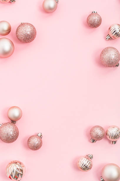 istock Decorative pink shiny balls, place for text on a pink background. Top view, flat lay. 1445949267