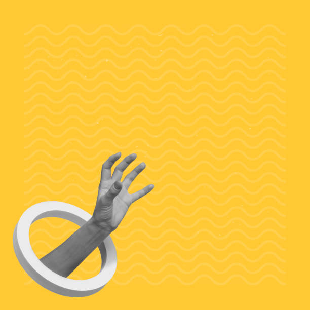 istock Male hand catching an invisible object on a creative abstract yellow background 1445949429
