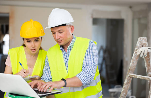 istock Man and woman engineers using laptop 1445950210
