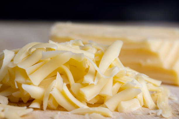 istock Sliced and grated hard cheese with cashew nuts 1445953232