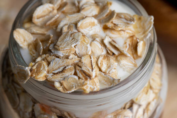 Fresh delicious yogurt made from milk with walnuts and muesli, dairy products with nuts and cereals