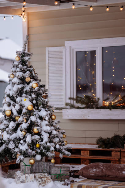 istock A snow-covered Christmas tree decorated with toys 1445955459