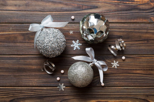 istock Christmas ball on colored background. decoration bauble with ribbon bow with copy space 1445970262
