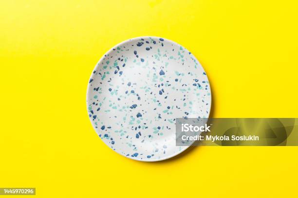 Top View Of Isolated Of Colored Background Empty Round Blue Plate For Food Empty Dish With Space For Your Design Stock Photo - Download Image Now