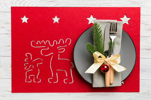 Christmas dinner background with rustic decorations and kitchen utensil . View from above.